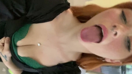 Playful Redhead Teases In Green Lace